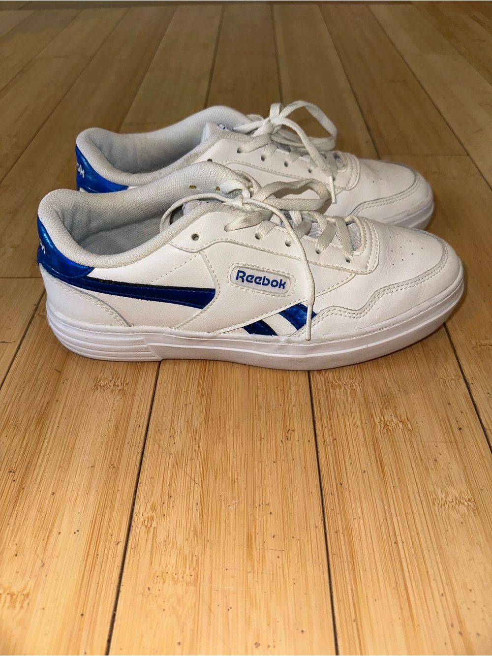 Reebok White Sneakers with Blue Metallic Stripes